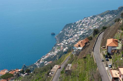 a road on the side of a hill next to the water at Hotel le Rocce - Agerola, Amalfi Coast in Agerola