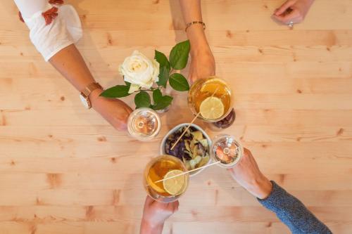 a group of people holding glasses of wine at la belle vue Boutique Hotel & Café in Spiez