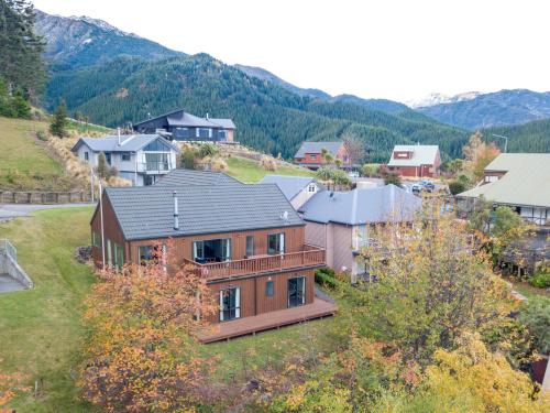 an aerial view of a house on a hill at Treetop Lodge - Acheron Holiday Home in Hanmer Springs