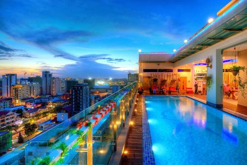 a swimming pool on the roof of a building at Orussey One Hotel & Apartment in Phnom Penh