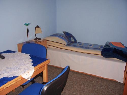 
Łóżko lub łóżka w pokoju w obiekcie Gosciniec Nad Stawem
