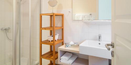 Koupelna v ubytování Hotel am Schlosspark garni