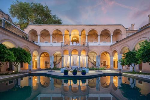 an exterior view of a mansion with a swimming pool at Imaret in Kavala