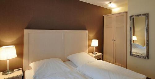 Postel nebo postele na pokoji v ubytování Hotel am Schlosspark garni