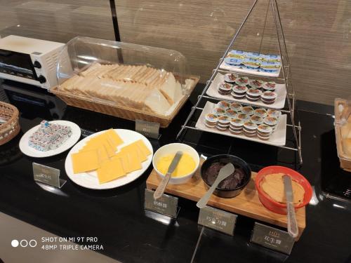 a display of different types of food on a table at Hu House in Kaohsiung