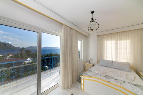 a bedroom with a bed and a large window at Otto Home Sea View Private Apartment in Sogut village Marmaris in Sogut