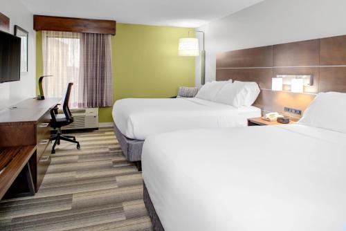 a hotel room with two beds and a desk at Holiday Inn Express - Chester by IHG in Chester