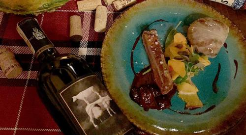 a plate of food sitting on top of a table at Ostoja Spokoju in Olchowiec