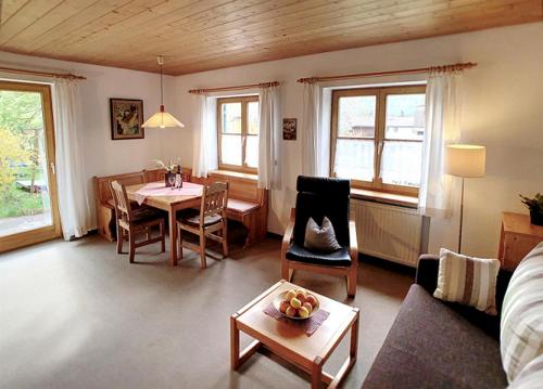 a living room with a table and a dining room at Haus Claudia Lipp in Bad Hindelang