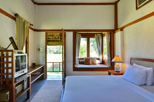 Postel nebo postele na pokoji v ubytování Belle Villa Resort, Pai