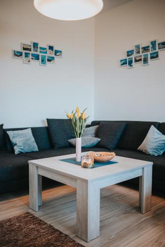 a coffee table in a living room with a couch at Apartmán Tatranská Lomnica in Tatranská Lomnica
