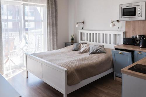 Ένα ή περισσότερα κρεβάτια σε δωμάτιο στο Apartamenty w Świnoujściu