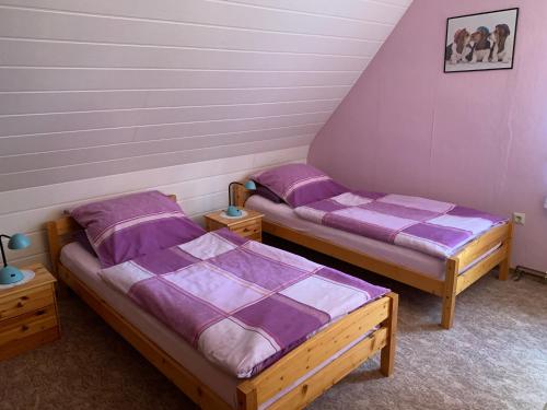 Katil atau katil-katil dalam bilik di Ferienwohnung Duensing
