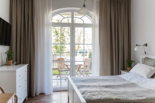 Postel nebo postele na pokoji v ubytování Apartamenty w Świnoujściu