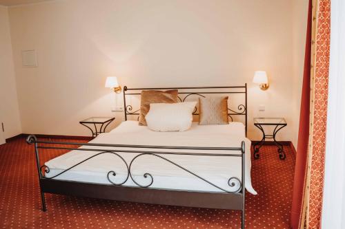 Кровать или кровати в номере Hotel am Wallgraben