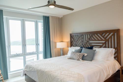 En eller flere senge i et værelse på Tigers Eye Condo Grenada