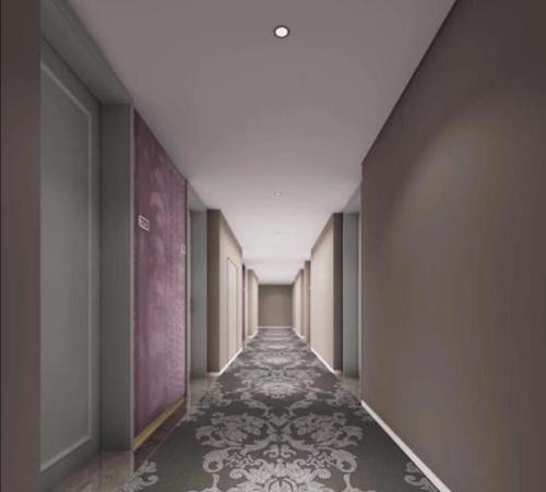 an empty hallway with a long corridor with a long corridorngthngthngthngthngth at Mercure Shenzhen Sports Center Hotel in Shenzhen