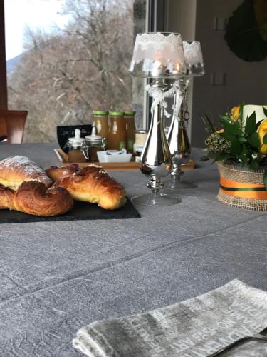 two loaves of bread sitting on top of a table at LE LANTERNE in Villa dʼAlmè