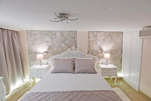 En eller flere senge i et værelse på Holiday Home Mila