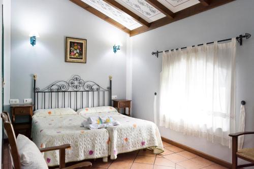 Säng eller sängar i ett rum på Hospedium Hotel Rural Soterraña
