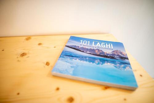 a book sitting on top of a wooden table at B&B Sopralapanca in Postalesio