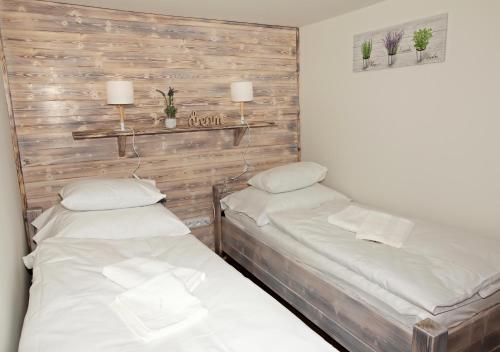 Postel nebo postele na pokoji v ubytování Ubytování pod Rozhlednou