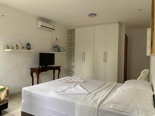 Katil atau katil-katil dalam bilik di Porto das Palmeiras Hostel