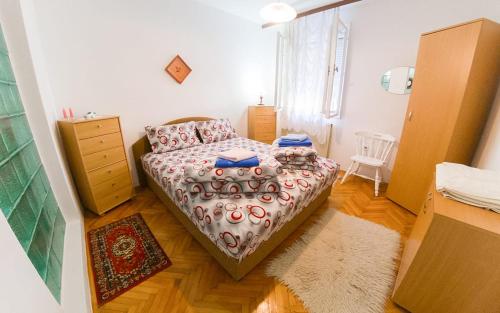 Postel nebo postele na pokoji v ubytování Apartmani Didić