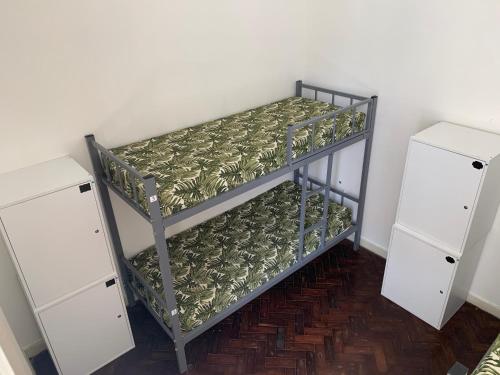 Katil atau katil-katil dalam bilik di Porto das Palmeiras Hostel