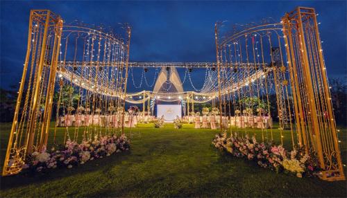 an outdoor wedding venue with lights and flowers at The Mangrovetree Sanya Resort in Sanya