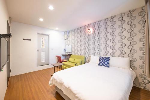 Postel nebo postele na pokoji v ubytování Luodong Nightmarket Homestay