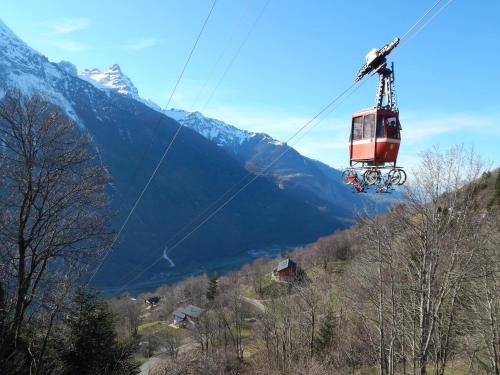 a gondola ride up a mountain in the mountains at L Ame et Son du Coeur in Dorénaz