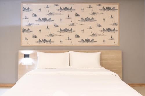 Postel nebo postele na pokoji v ubytování PLAAI Play Hotel