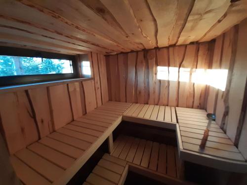 an inside view of a wooden sauna with a window at Sämi Siil in Sämi