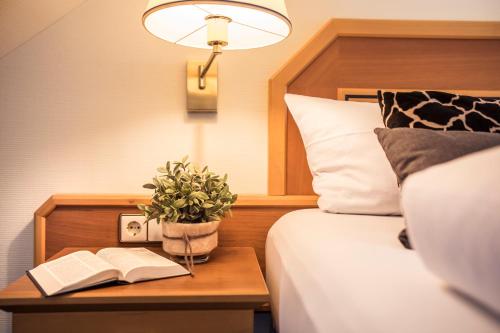 Ένα ή περισσότερα κρεβάτια σε δωμάτιο στο Sunderland Hotel