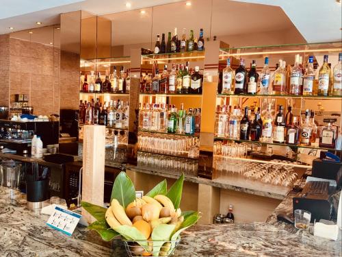 a bar with a bunch of bottles of alcohol at VIME La Reserva de Marbella in Marbella
