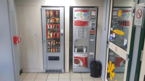 two vending machines in a store with drinks at Premiere Classe Périgueux - Boulazac in Boulazac
