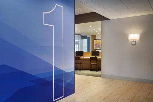 an image of an office lobby with a blue wall at Holiday Inn Express & Suites Clear Spring by IHG in Clear Spring