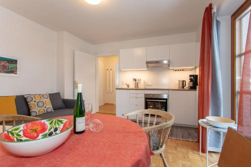 a kitchen and living room with a table with a bowl on it at Ferienwohnungen Knippschild in Lofer