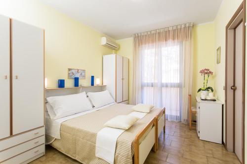 Postel nebo postele na pokoji v ubytování Hotel Valentino