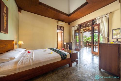 Ένα ή περισσότερα κρεβάτια σε δωμάτιο στο Treasure of Bali, 3BR villa, infinity pool, staff