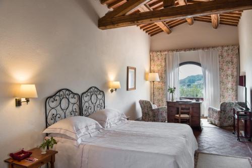 Postel nebo postele na pokoji v ubytování Hotel Le Fontanelle