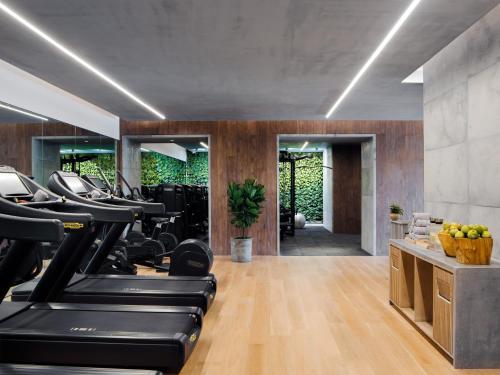 a gym with treadmills and elliptical machines at 1 Hotel Haitang Bay, Sanya in Sanya