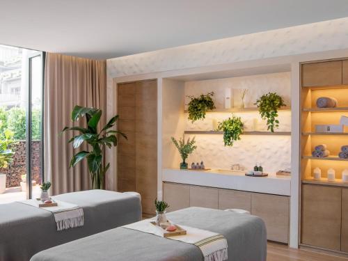 two beds in a room with plants on the wall at 1 Hotel Haitang Bay, Sanya in Sanya