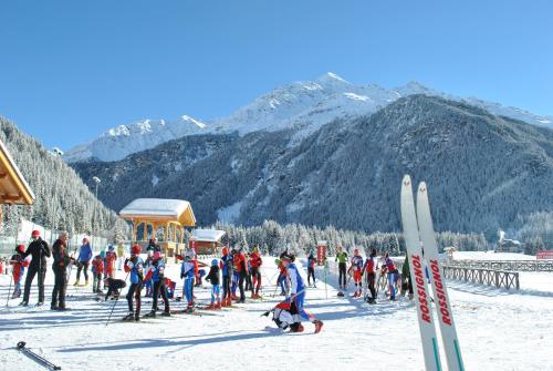 a group of people are skiing in the snow at Hotel Pedranzini in Santa Caterina Valfurva