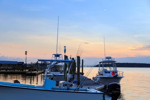 two boats docked at a dock in the water at Breakers 215 in Hilton Head Island