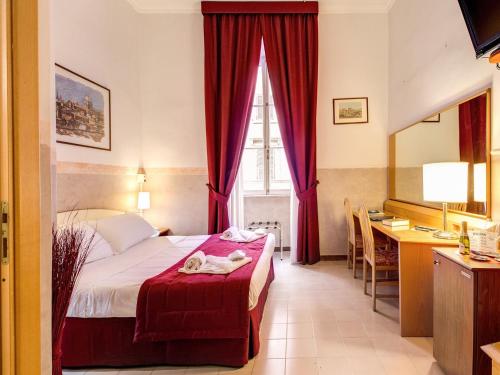 Lova arba lovos apgyvendinimo įstaigoje Hotel Giotto Flavia