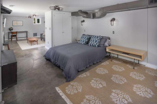 a bedroom with a bed and a living room at Southeast Portland Retreat in Portland