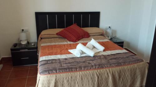 Кровать или кровати в номере Pension Gran Plaza