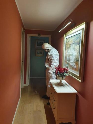 a person is standing in a hallway in a room at Allaportaccanto Bed & Breakfast in Cassino